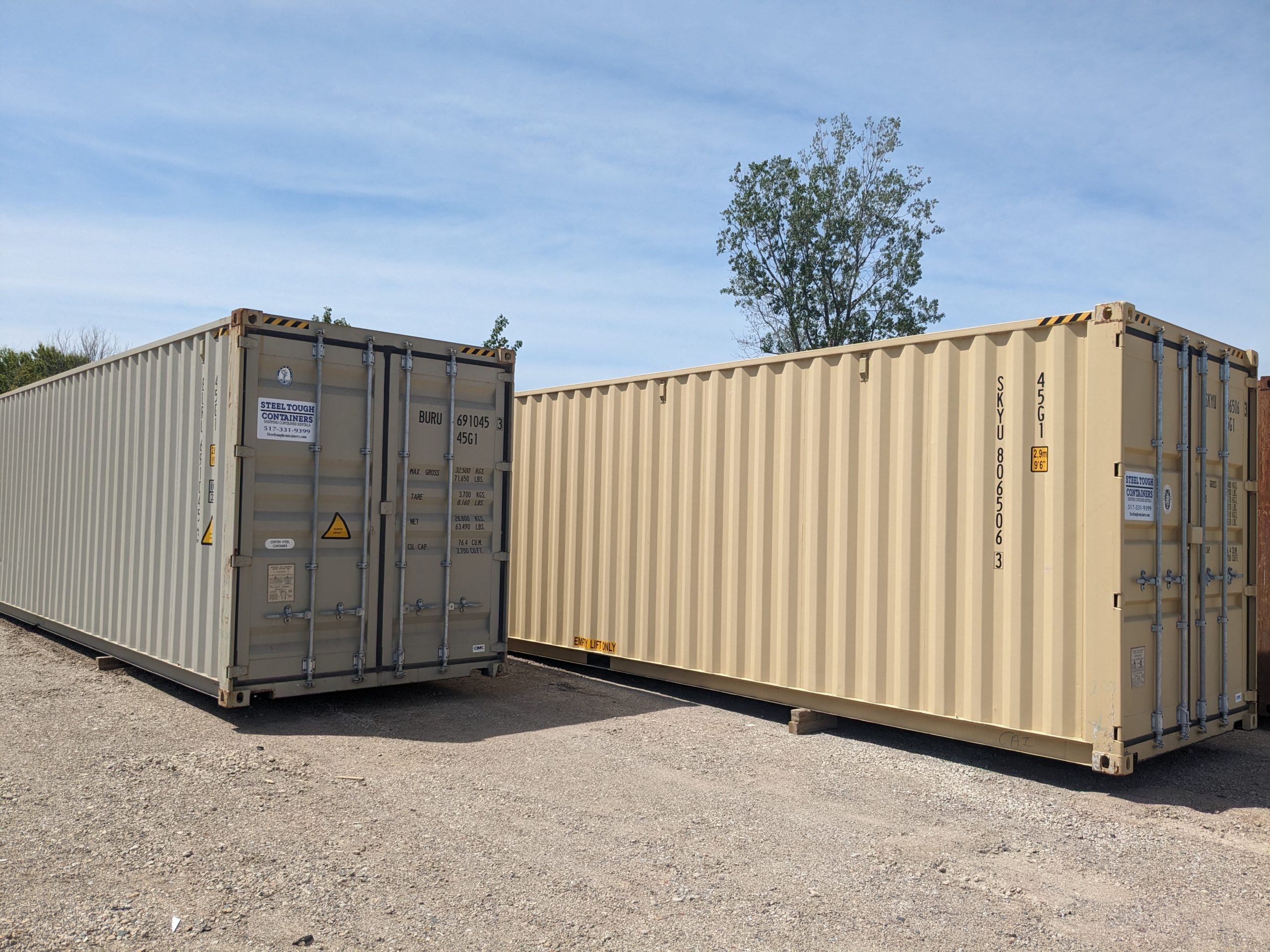Steel Tough Containers company building with US flag, call (517) 331-9399